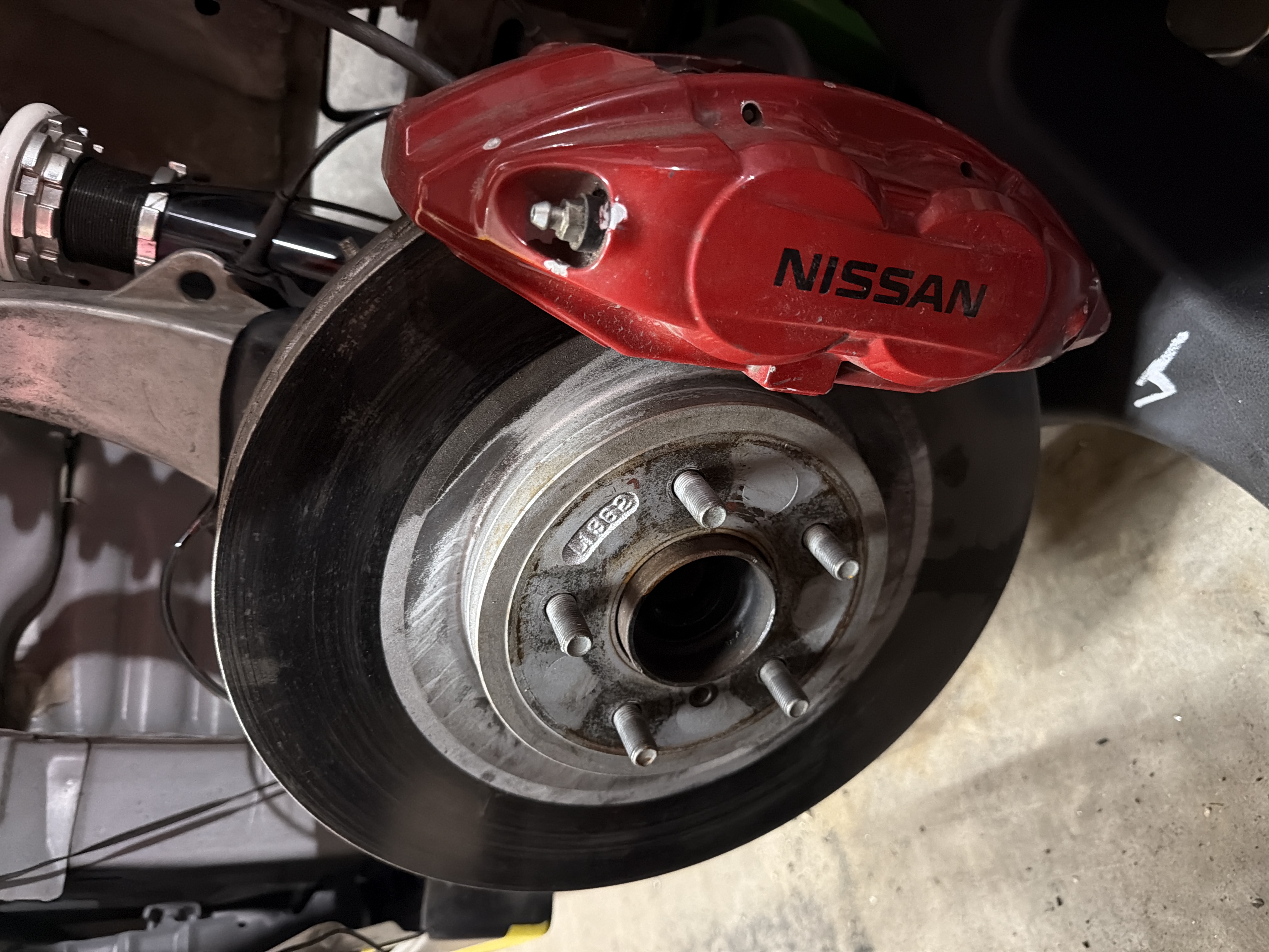 Nissan Z32 4-pot front calipers (red) + rotors — S13/S14 big brake swap — 1995 Nissan